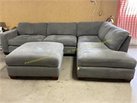 Two-piece sectional couch with ottoman-gray