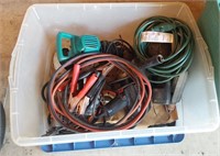 plastic tub of power tools and jumper cables