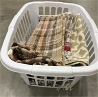 Basket of clean throw rugs