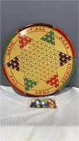Round Chinese checker board and bag of marbles.