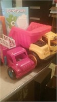 Group of two toy trucks dump truck and fire truck