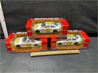 3 die cast race cars