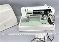Dressmaker sewing machine with foot pedal