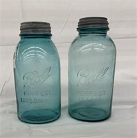 pair of blue Ball half gallon jars