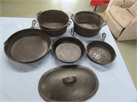 2 cast iron pots, 3 cast iron skillets,