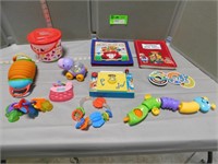 Assorted child's and baby toys and cloth cover boo