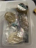 Jewelry making supplies in plastic shoebox