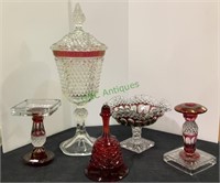 Five pieces of cranberry and clear glass. Pieces