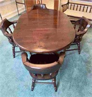 Dark pine oval table with four chairs and two