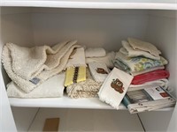 Miscellaneous bathroom towels and rugs, scale