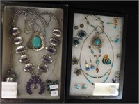 Two containers of costume jewelry including