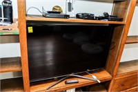 Samsung 48" Flatscreen TV and (3) Sony DVD Players