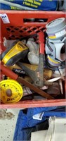 Crate of tools stud finder caulk etc
