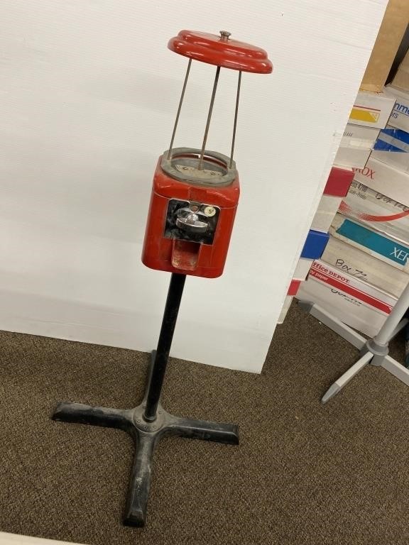 Vintage Red Coin-Operated Gumball Machine on Stand