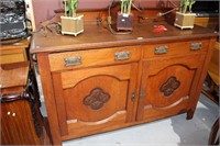 Arts and Crafts oak sideboard featuring