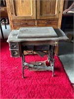 White sewing machine with treadle base