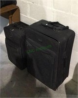 Two pieces of Jaguar luggage with rolling