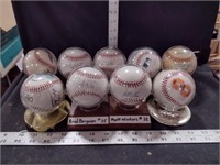 9 Baseballs; 7 Signed, One Cal Commemorative &