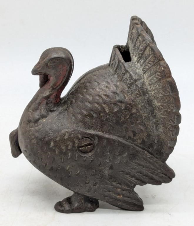 (R) Cast iron turkey coin bank (4.25" tall).