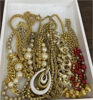 Beautiful Gold toned costume jewelry in wooden