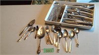 Assorted silverware and serving utensils