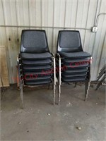 Lot of 12 stacking student office chairs.