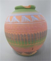 Signed Native American pottery vase. Note: Has