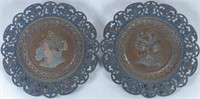 PAIR OF CAST IRON FIGURAL WALL PLAQUES