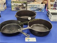 THREE CAST IRON COOKING VESSELS