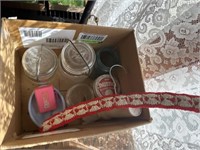 5 Mason jars with bead necklaces