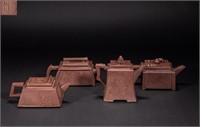 A set of purple clay pots