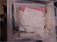 Container of vintage toddler clothing, bedding