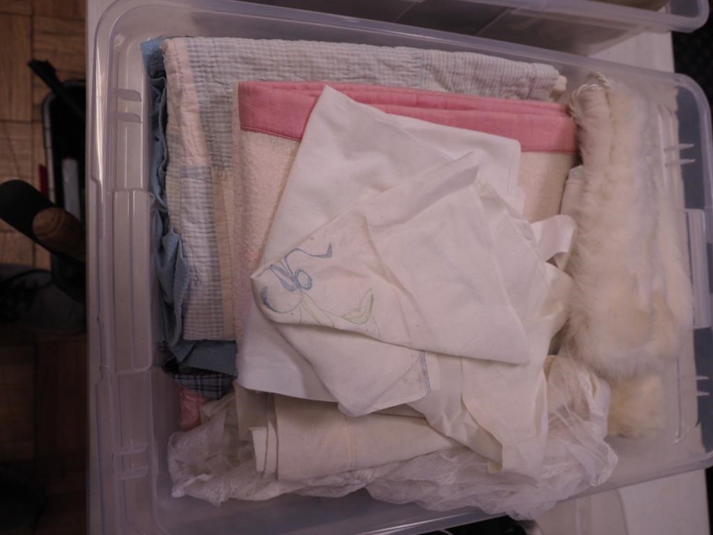 Container of vintage toddler clothing, bedding