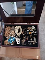 Jewelry box with costume jewelry and drawers