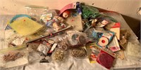 Assortment of craft supplies and crochet needles
