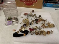 Costume  earrings, rings in a three drawer case
