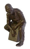 Bronze Man Sitting on Box