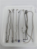 SEVEN STERLING NECKLACES, SOME WITH PENDANTS