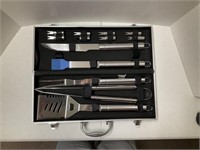 New 9 pc. BBQ set in metal carrying case