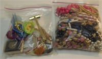 (2) BAGS COSTUME JEWELRY NECKLACES-HAIR TIES.