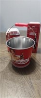 (2) Coca-Cola tins and (1) bucket
