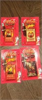Set of 4 Coca-Cola miniature playing cards on a