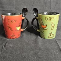 2 ceramic coffee cups w/ Spoons 1 red 1 green.