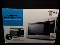 New Samsung 1.1 cu ft Microwave Oven. Model