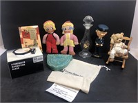 Magnifying glass, dolls, bobble head, ashtray