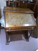 Unusual desk with storage door on right with two