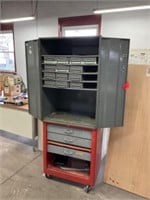 Gray storage cabinet with pull outs and red base