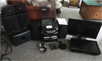 Assorted stereo, surround , speakers + 2 flat tvs