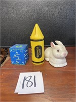 3 piggy banks, bunny, crayon and block