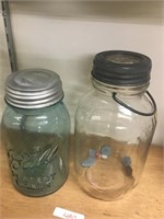 green bell jar and clear jar